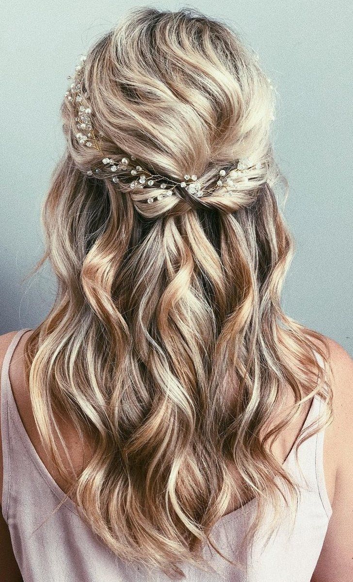 Half up half down wavy hair with delicate headpiece. // Gorgeous half up half down bridal hairstyle ideas to impress on your wedding day. // mysweetengagement.com