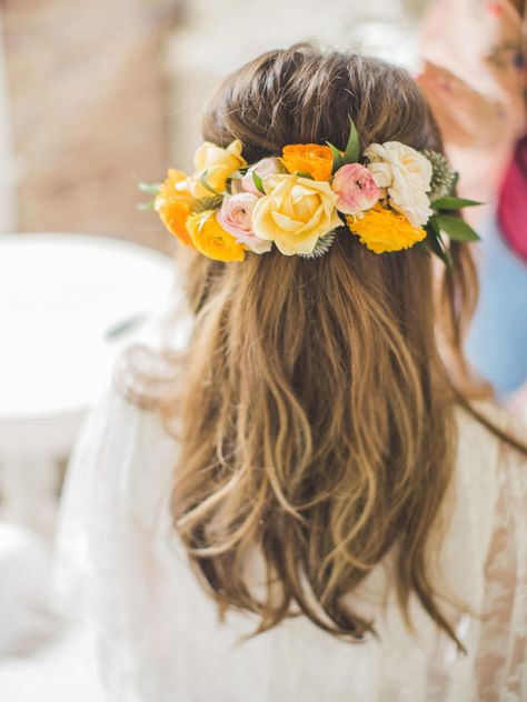 Romantic half up half down hairstyle with bold floral embellishment. // Gorgeous half up half down bridal hairstyle ideas to impress on your wedding day. // mysweetengagement.com