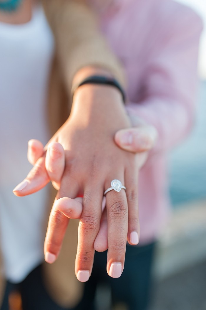 Pear shaped (teardrop) engagement ring ideas: Platinum ring with halo. Lovely ring photo idea for an engagement announcement. // mysweetengagement.com