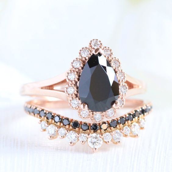 Pear shaped (teardrop) engagement ring ideas with black diamond on split rose gold band with vintage halo paired with wedding band
