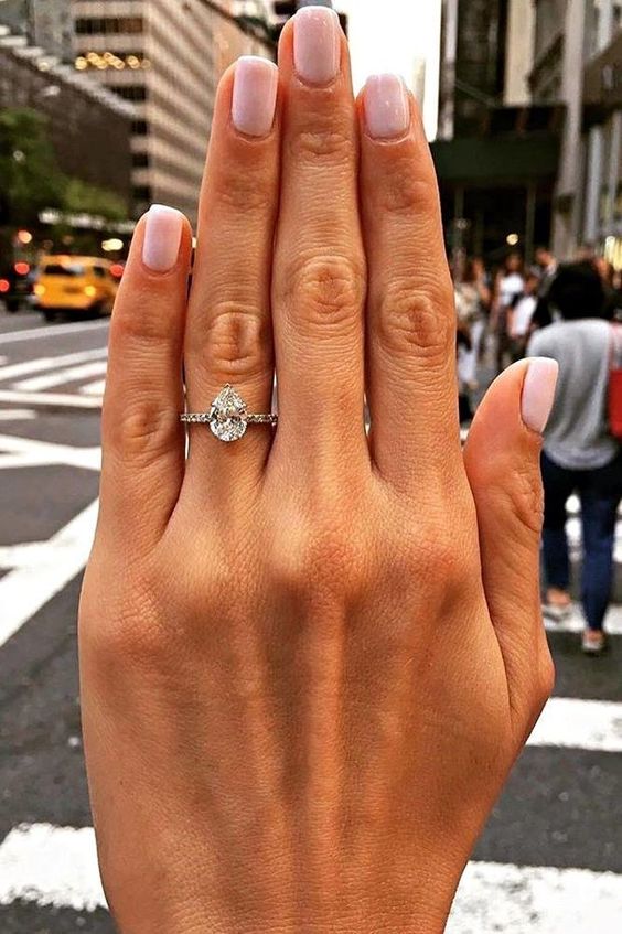 Pear shaped (teardrop) engagement ring ideas: solitaire diamond on platinum setting. // mysweetengagement.com