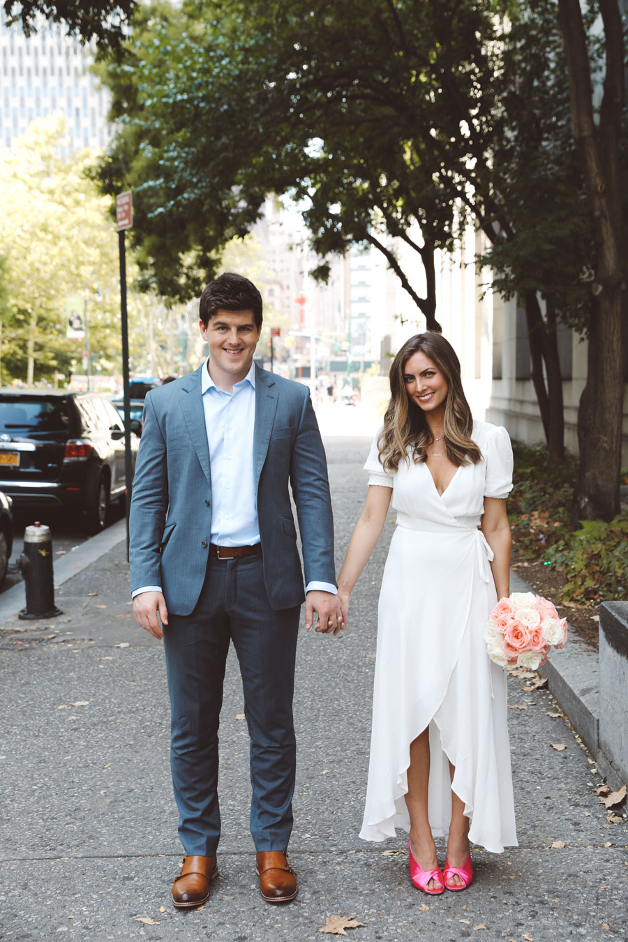 Love how casual-chic this bride and groom are dressed for their courthouse wedding. Obsessed with her pink heels. // See more: 20 Stunning Civil Wedding Outfit Ideas to Make it Official In Style. // mysweetengagement.com