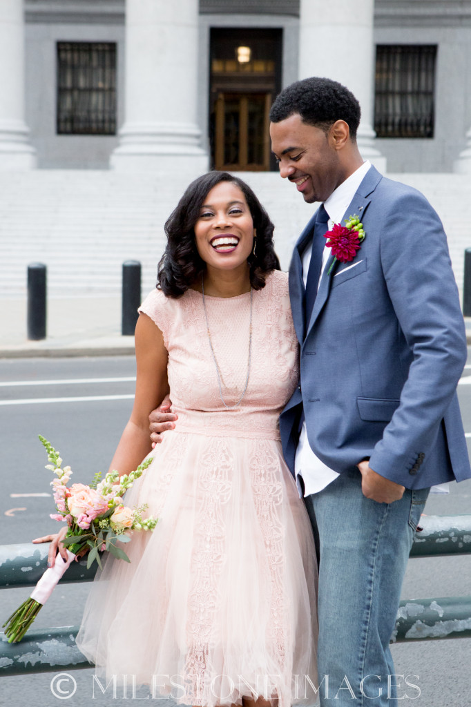 This couple nailed the casual-chic look. The bride is wearing a non-traditional pink small dress and the groom is wearing suit and tie with jeans. // See more: 20 Stunning Civil Wedding Outfit Ideas to Make it Official In Style. // mysweetengagement.com