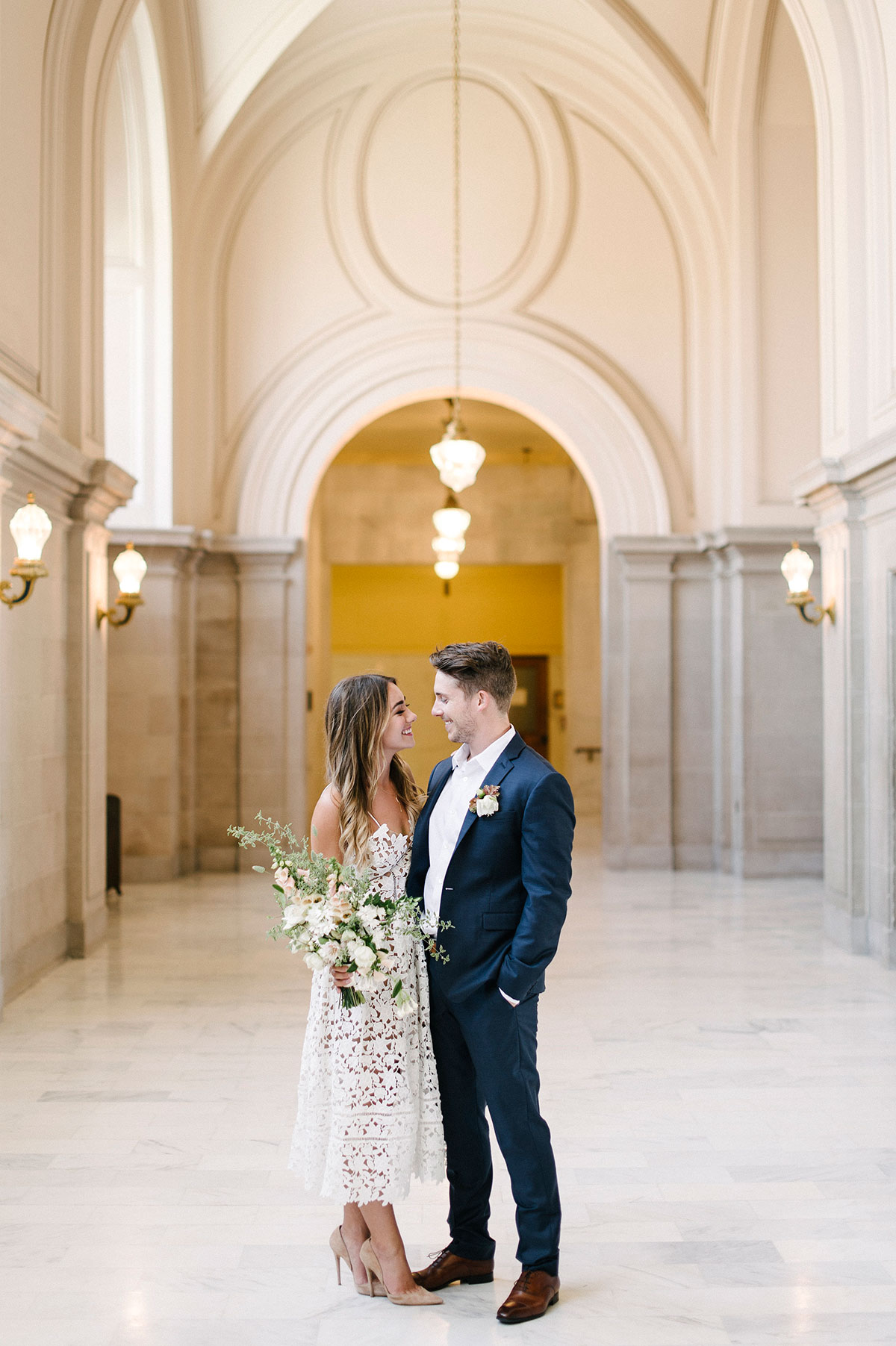 Elegant bride and groom courthouse wedding outfit. Love her lace white dress. // See more: 20 Stunning Civil Wedding Outfit Ideas to Make it Official In Style. // mysweetengagement.com
