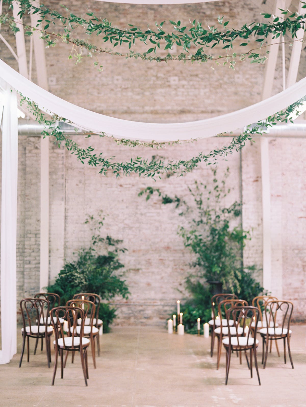 Stunning minimalist indoor wedding ceremony decor with greeneries and white draping. // ❤️ Check Out These Gorgeous 20 Indoor Wedding Ceremony Ideas. // https://mysweetengagement.com/indoor-wedding-ceremony-ideas