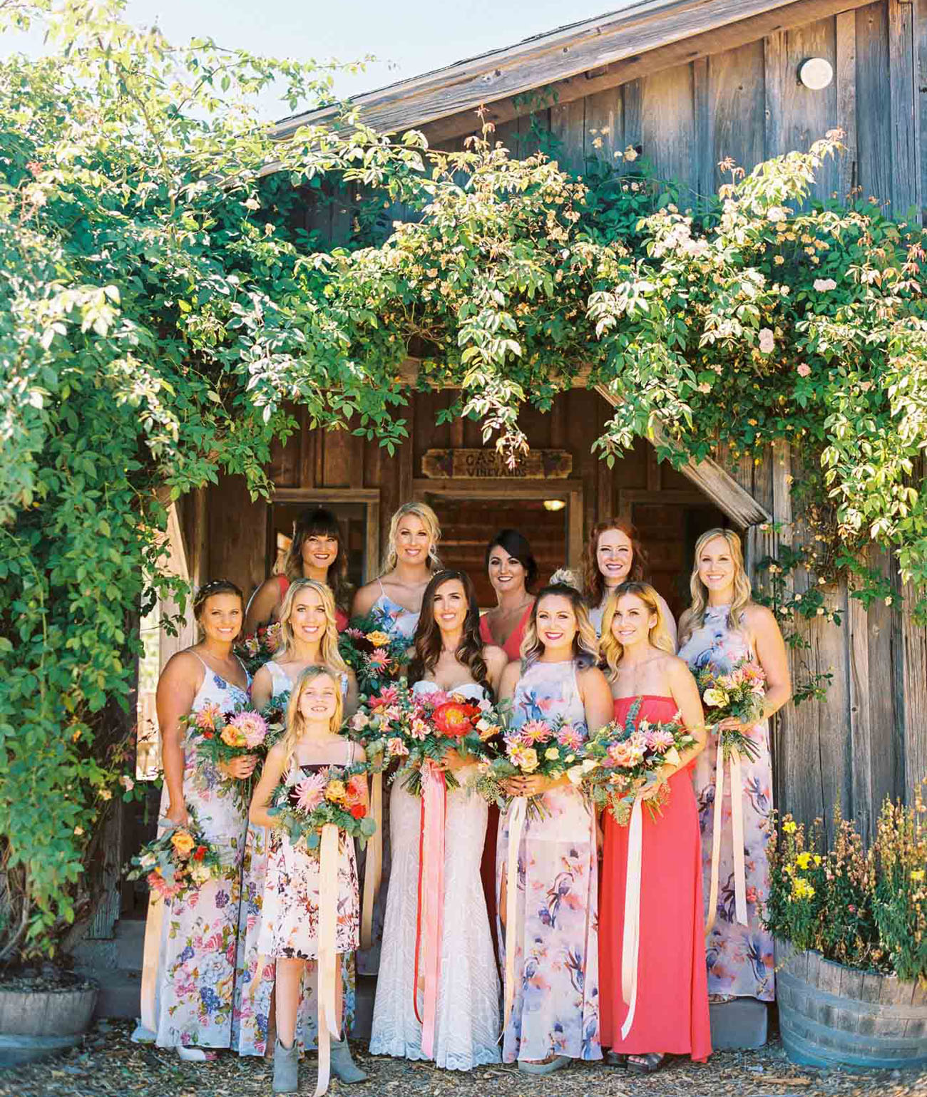 mix and match coral and floral bridesmaid dresses