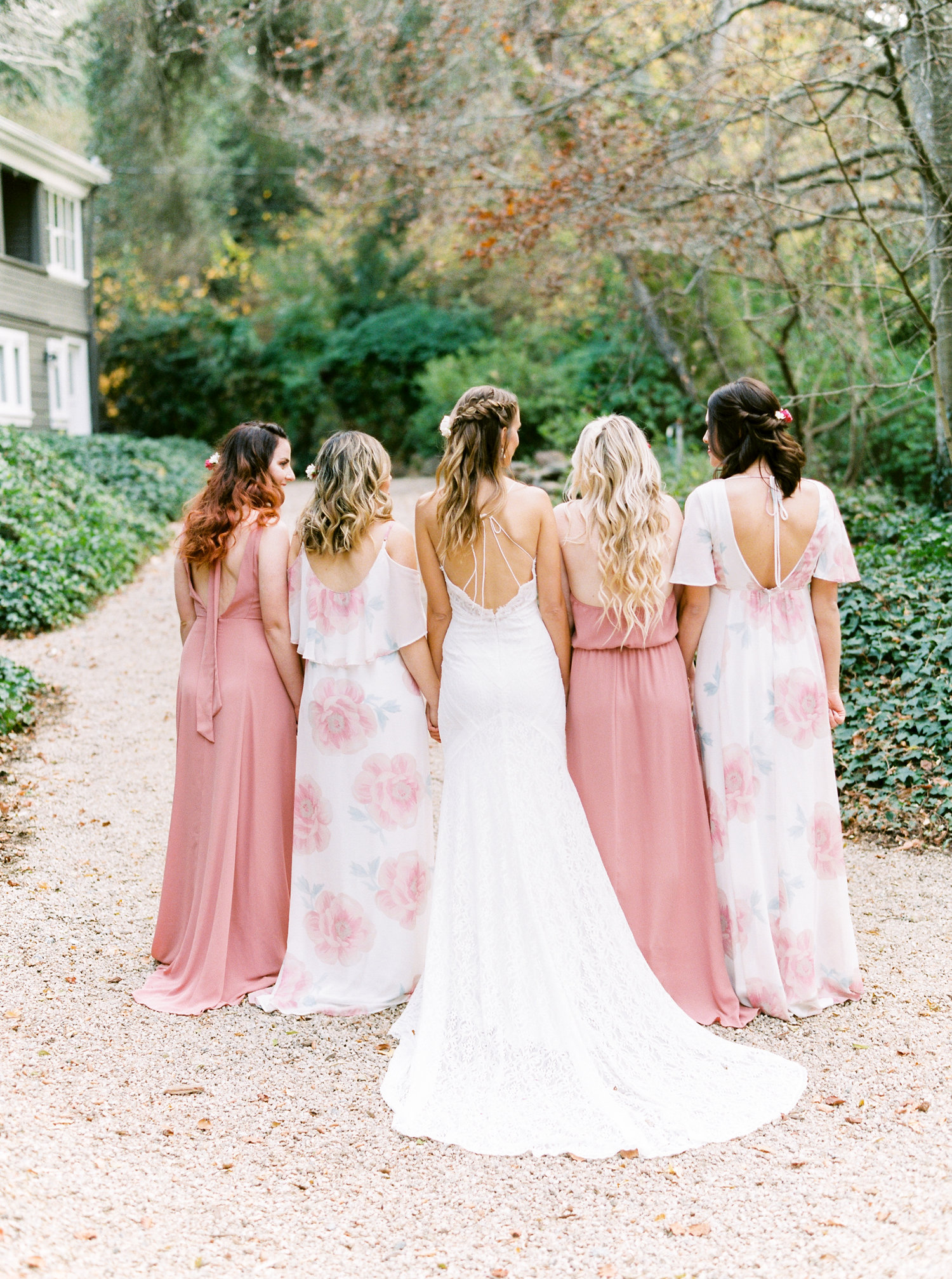 Mismatched blush and floral bridesmaid dresses