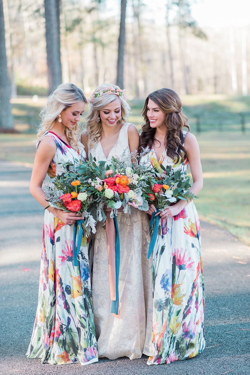 bride and bridesmaid portrait photo. Bridesmaids with floral pattern dresses