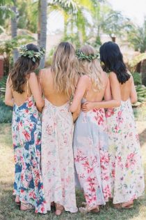 bridesmaids back portraits with floral dresses and greenery crowns