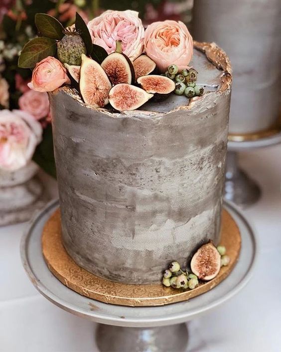 1 tier concrete wedding cake topped with peonies and figs