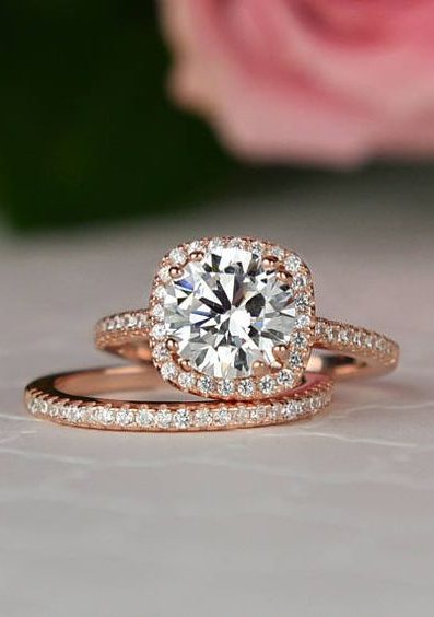 gold band engagement ring with white diamonds and round center stone