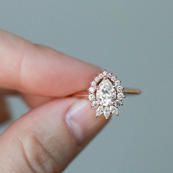 pear shaped engagement ring on gold band and vintage setting