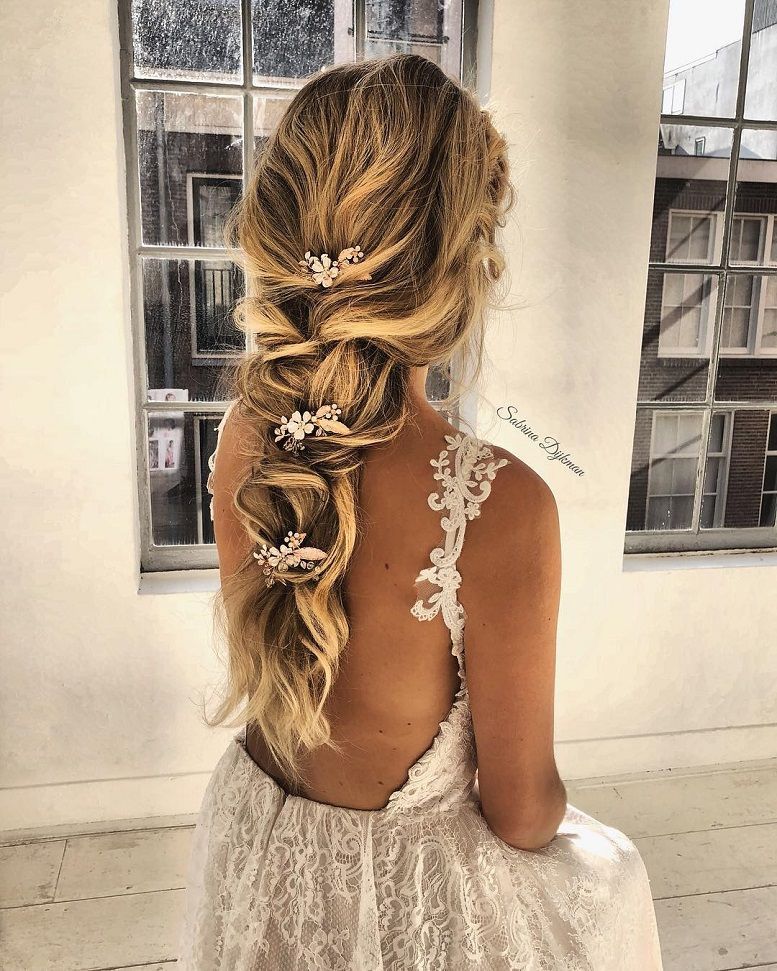 romantic boho bridal hairstyle on blond long hair with small delicate flowers