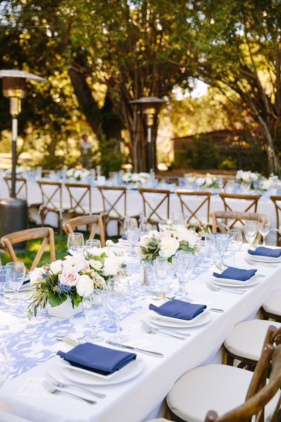 white wedding reception decoration with blue accents
