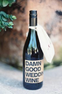 Personalized Wine Bottle with label saying "Damn Good Wedding Wine"