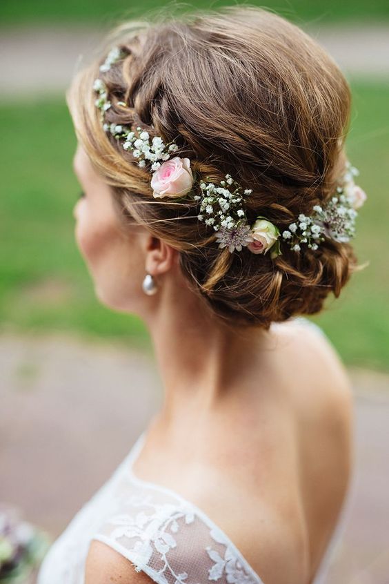 bride wearing hair up with and delicate floral crown