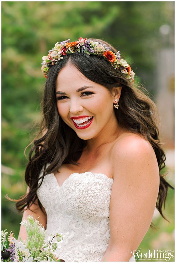 bride wearing long dark hair down topped with floral crown