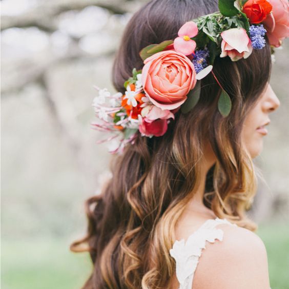 bride wearing hair down and coral flowers floral crown