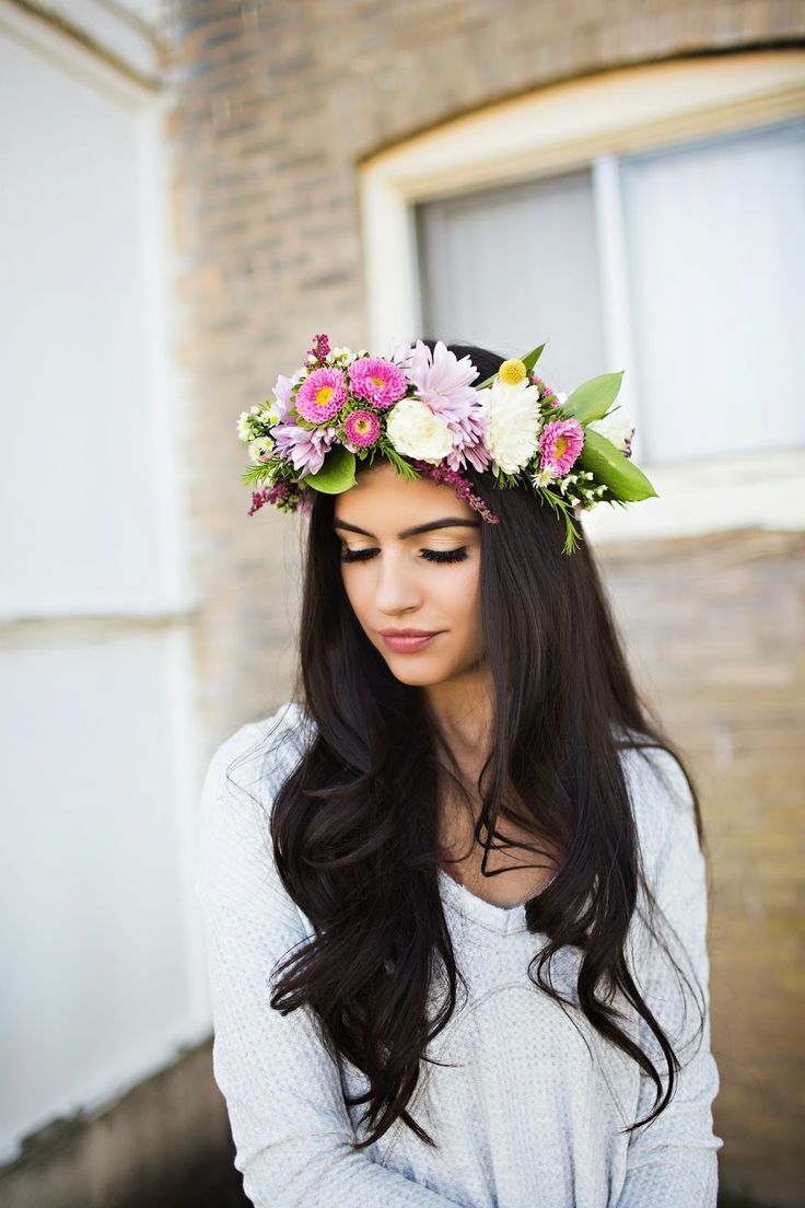 bride with long dark hair wearing hair down and statement floral crown