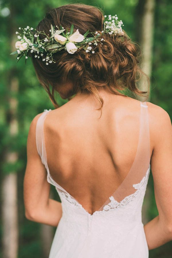 bride wearing hair updo topped with delicate floral crown