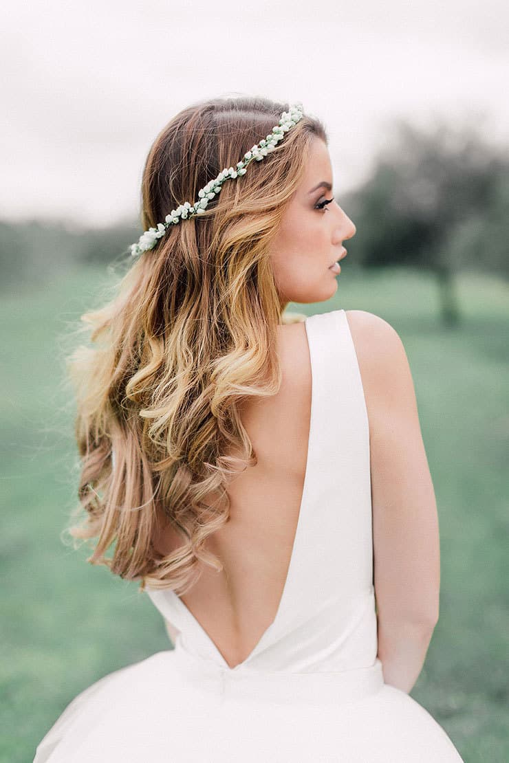 bride with long blonde hair wearing hair down and delicate floral crown