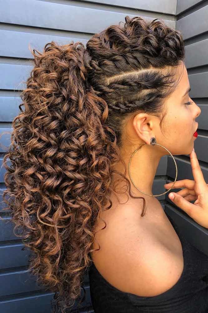 woman with curly hair on a ponytail, with braided strands