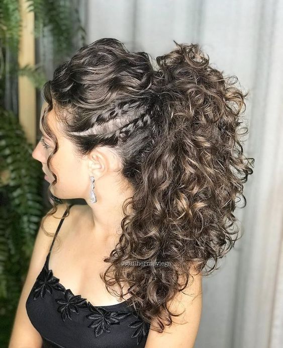 beautiful messy ponytail hairstyle on curly hair, with small braids on the side of the hair, perfect for a wedding
