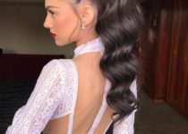 modern and elegant bride with red lipstick and slick high ponytail, with glamorous waves