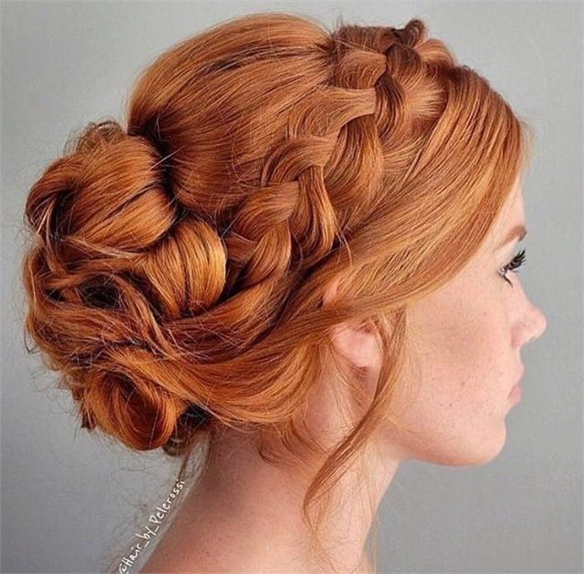 red hair bride wearing a braided bun for her wedding day