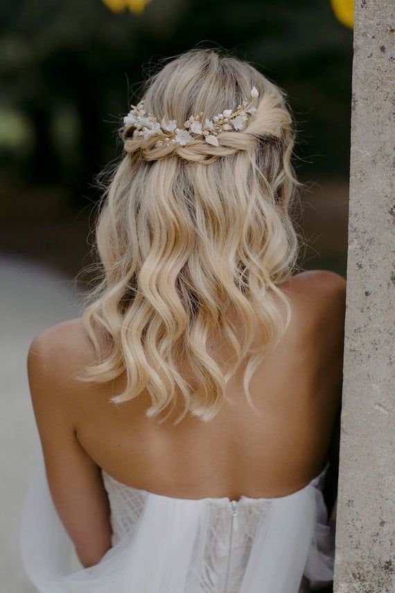blonde half up half down bridal hair style with floral hairpiece