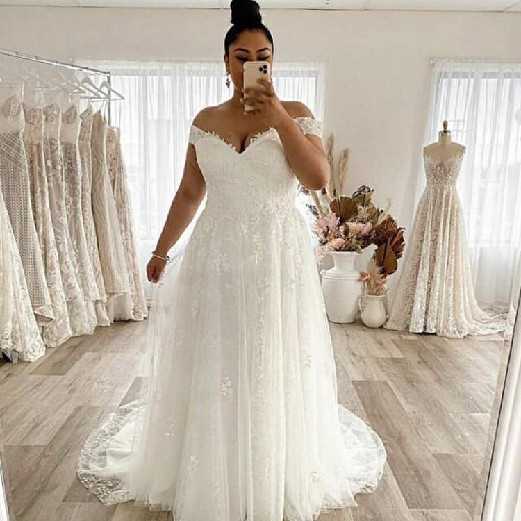 Off the shoulder lace plus size wedding dress for curvy bride